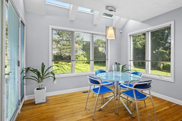 26 Sherwood Rd, Swampscott, MA 01907 - dining room featuring a skylight, plenty of natural light, baseboards, and vaulted ceiling