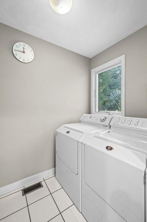 26 Sherwood Rd, Swampscott, MA 01907 - laundry area featuring independent washer and dryer, light tile patterned flooring, and baseboards