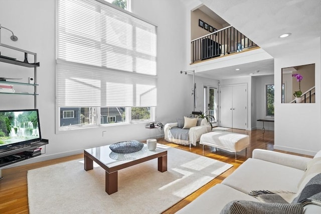 26 Sherwood Rd, Swampscott, MA 01907 - living area featuring a high ceiling, wood finished floors, healthy amount of natural light, baseboards, and recessed lighting