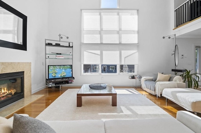 26 Sherwood Rd, Swampscott, MA 01907 - living room featuring a high ceiling, a fireplace, and wood finished floors