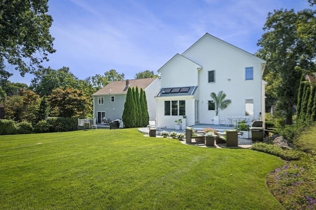 26 Sherwood Rd, Swampscott, MA 01907 - back of house with a yard, a patio area, and a standing seam roof