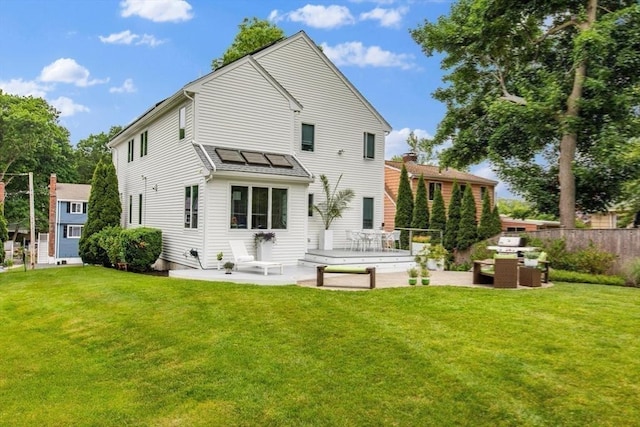 26 Sherwood Rd, Swampscott, MA 01907 - back of house featuring a patio area, outdoor lounge area, and roof mounted solar panels