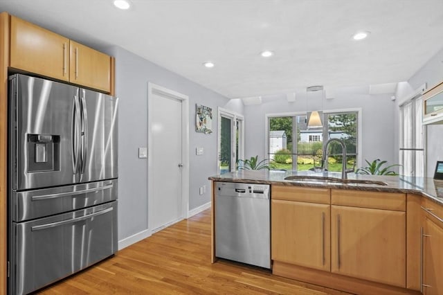 26 Sherwood Rd, Swampscott, MA 01907 - kitchen featuring stainless steel appliances, a sink, dark stone countertops, light wood-type flooring, and recessed lighting