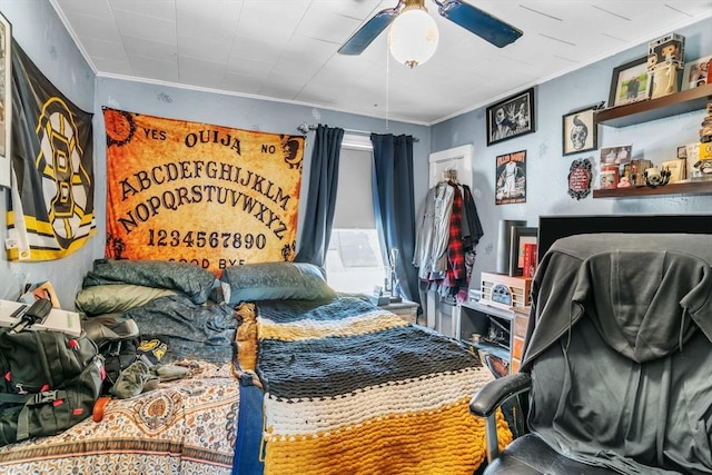 bedroom with ornamental molding and ceiling fan