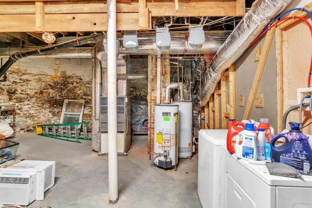 basement featuring water heater and washer and dryer