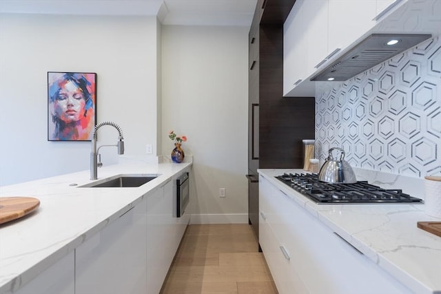 577 Masscahusetts Unit C, Boston, MA 02118 - kitchen with modern cabinets, a sink, white cabinetry, and baseboards
