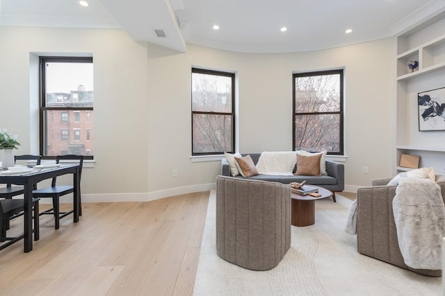 577 Masscahusetts Unit C, Boston, MA 02118 - living area with light wood finished floors, built in features, plenty of natural light, baseboards, and recessed lighting