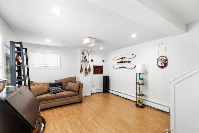 living room featuring baseboard heating and wood-type flooring