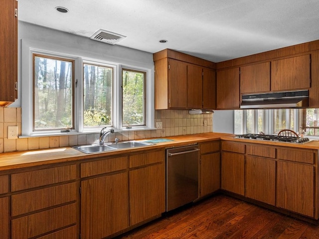 104 Tower Rd, Lincoln, MA 01773 - kitchen featuring appliances with stainless steel finishes, a sink, wooden counters, tasteful backsplash, and under cabinet range hood
