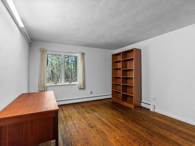 104 Tower Rd, Lincoln, MA 01773 - interior space with dark wood-type flooring, a textured ceiling, and baseboard heating