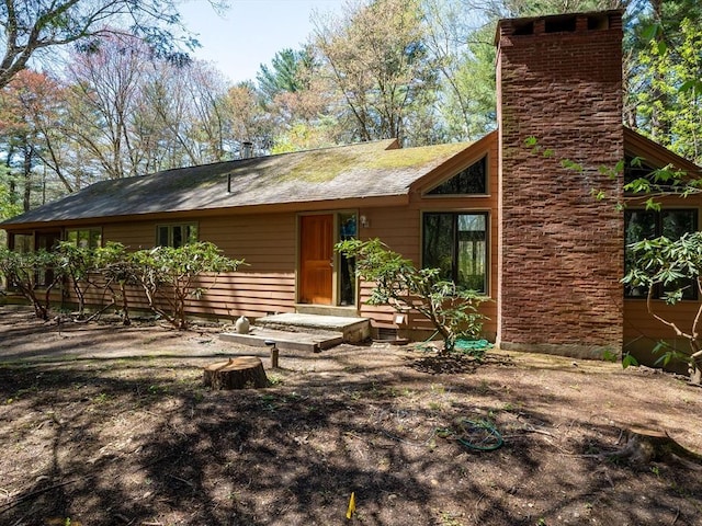 104 Tower Rd, Lincoln, MA 01773 - rear view of property with a chimney