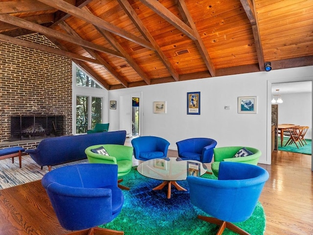 104 Tower Rd, Lincoln, MA 01773 - interior space featuring a brick fireplace, wood finished floors, beamed ceiling, high vaulted ceiling, and wooden ceiling