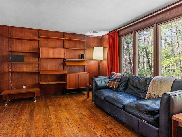 104 Tower Rd, Lincoln, MA 01773 - living room featuring dark wood-style flooring, visible vents, and a healthy amount of sunlight