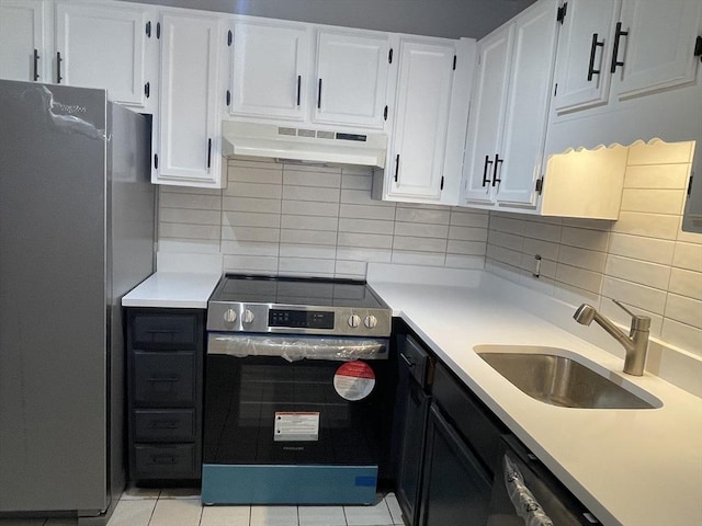 kitchen featuring appliances with stainless steel finishes, sink, and white cabinets