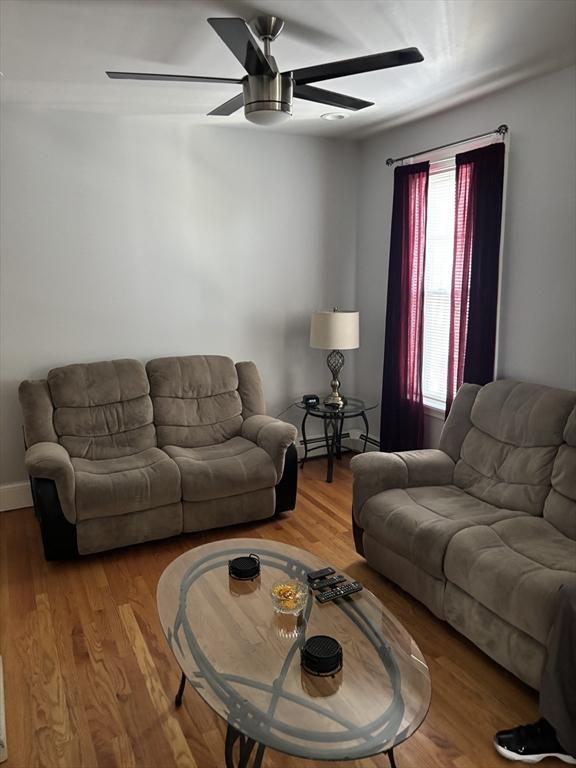 102-104 Robey St, Boston, MA 02119 - living area with a ceiling fan and wood finished floors
