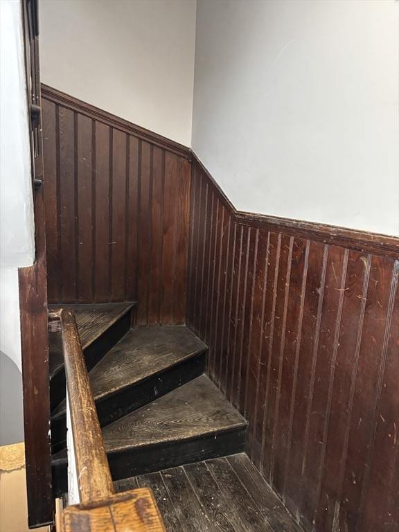 102-104 Robey St, Boston, MA 02119 - stairs with wooden walls, wainscoting, and hardwood / wood-style floors