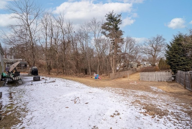 view of yard covered in snow