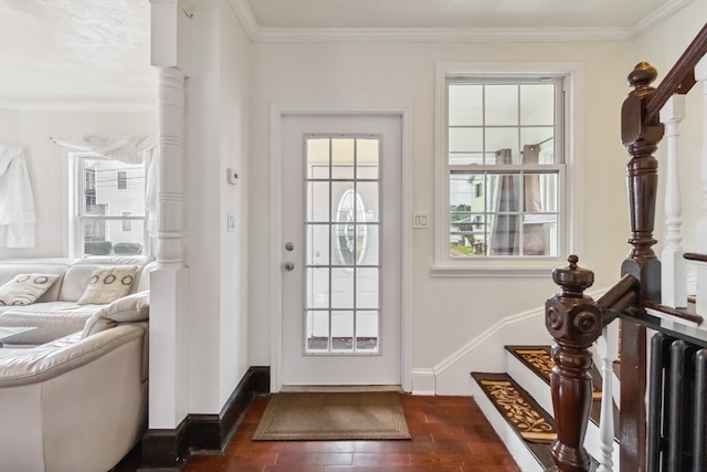 doorway to outside with crown molding, dark hardwood / wood-style flooring, and a wealth of natural light