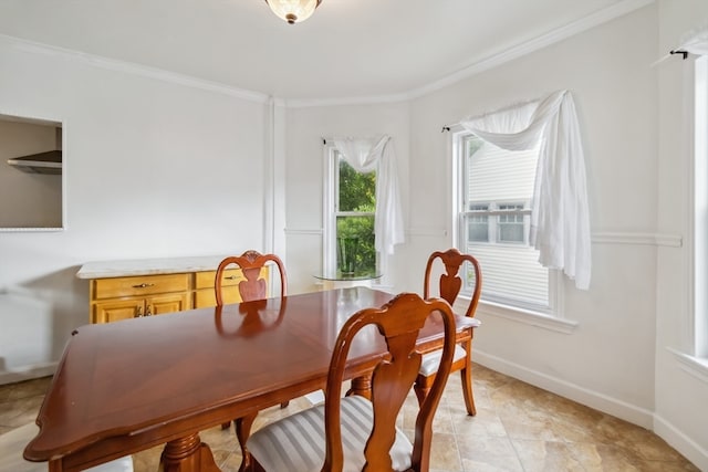 dining area featuring ornamental molding