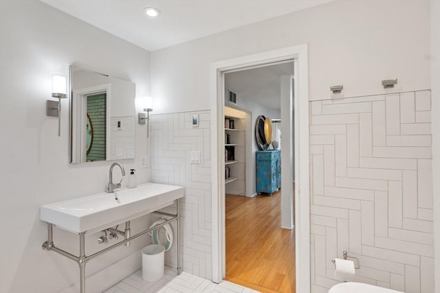 166 Quinapoxet Ln, Worcester, MA 01606 - bathroom with tile walls, toilet, and wood finished floors