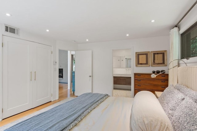 166 Quinapoxet Ln, Worcester, MA 01606 - bedroom with light wood-style floors, recessed lighting, and ensuite bath