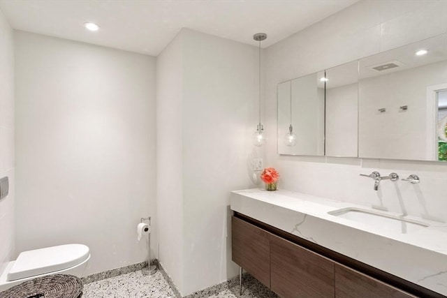 166 Quinapoxet Ln, Worcester, MA 01606 - bathroom with vanity, toilet, baseboards, and recessed lighting