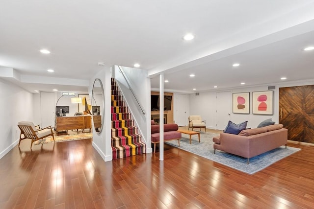 166 Quinapoxet Ln, Worcester, MA 01606 - living area featuring baseboards, wood finished floors, stairs, and recessed lighting