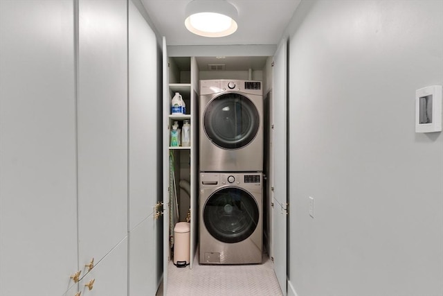 166 Quinapoxet Ln, Worcester, MA 01606 - washroom with stacked washer / drying machine and tile patterned flooring