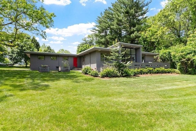 166 Quinapoxet Ln, Worcester, MA 01606 - back of house featuring a lawn and brick siding