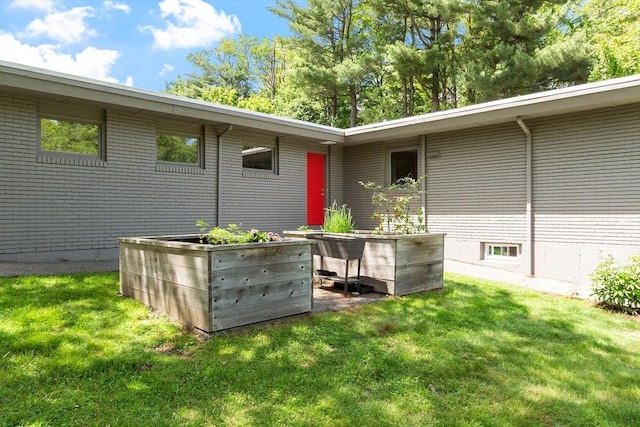 166 Quinapoxet Ln, Worcester, MA 01606 - view of side of property featuring a lawn and brick siding
