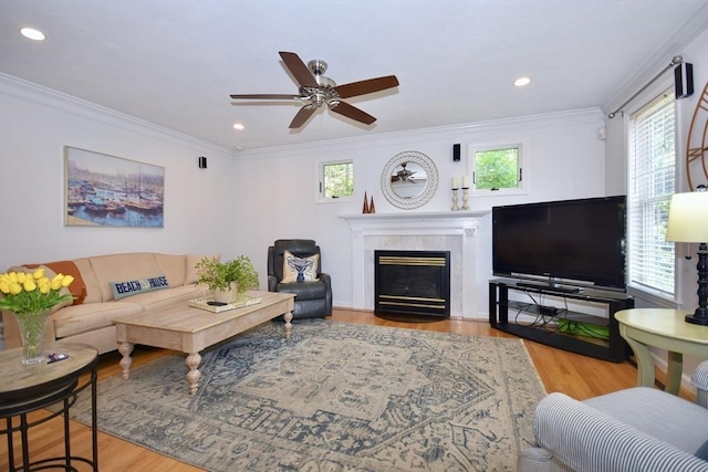 24 Sheppard Rd, Bourne, MA 02562 - living room with plenty of natural light, ceiling fan, a high end fireplace, wood finished floors, and ornamental molding