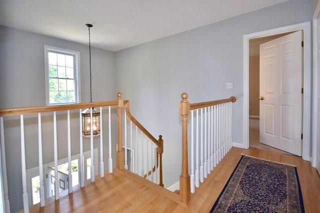 24 Sheppard Rd, Bourne, MA 02562 - hallway featuring an upstairs landing, wood finished floors, and a chandelier