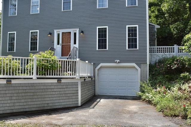 24 Sheppard Rd, Bourne, MA 02562 - view of front of property with an attached garage and asphalt driveway