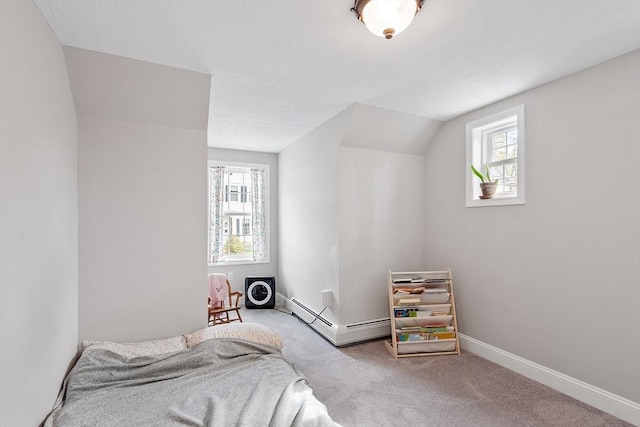 bedroom featuring carpet flooring, baseboards, and a baseboard heating unit