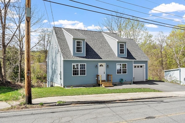 cape cod house with a front yard, aphalt driveway, a shingled roof, and a garage