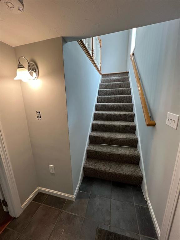 stairway with baseboards