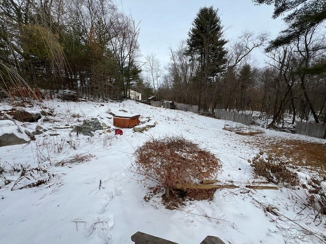 yard covered in snow with a garage