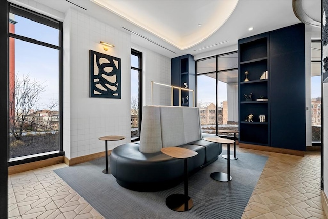 sitting room featuring a wall of windows