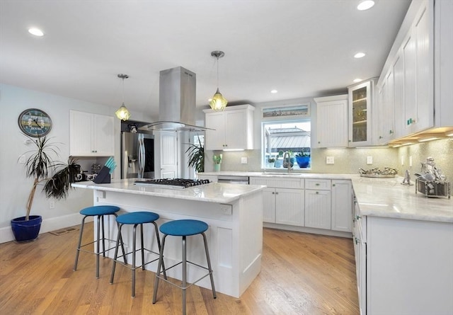 14 Lewis St, Hull, MA 02045 - kitchen with stainless steel appliances, island range hood, a sink, white cabinetry, and recessed lighting