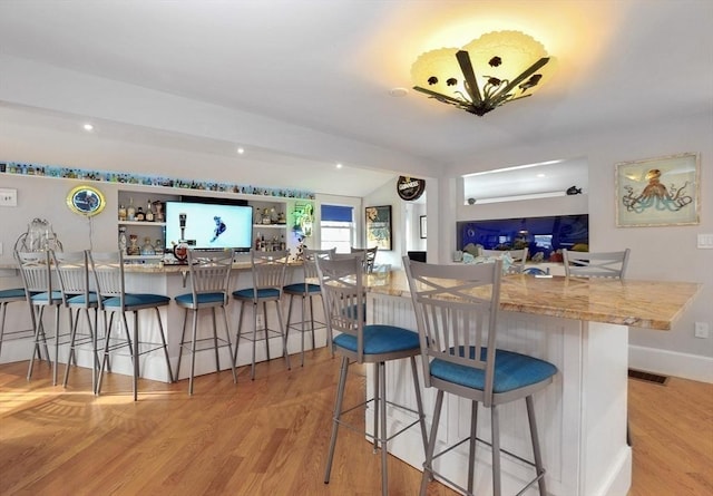 14 Lewis St, Hull, MA 02045 - kitchen featuring light wood finished floors and a kitchen breakfast bar