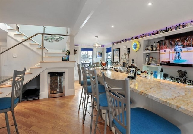 14 Lewis St, Hull, MA 02045 - indoor dry bar with wine cooler, stairs, light wood-style floors, and recessed lighting