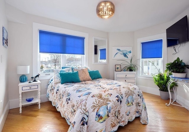 14 Lewis St, Hull, MA 02045 - bedroom with multiple windows, light wood-style flooring, and baseboards