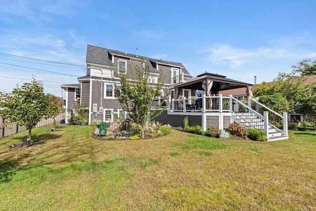 14 Lewis St, Hull, MA 02045 - back of house with a gazebo and a lawn