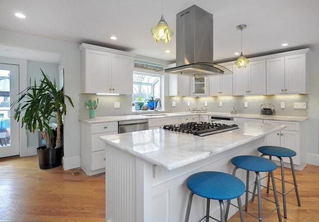 14 Lewis St, Hull, MA 02045 - kitchen featuring island range hood, a sink, appliances with stainless steel finishes, white cabinetry, and recessed lighting