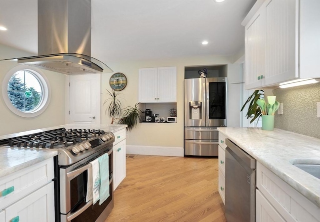 14 Lewis St, Hull, MA 02045 - kitchen with stainless steel appliances, island exhaust hood, white cabinets, light wood-style floors, and recessed lighting