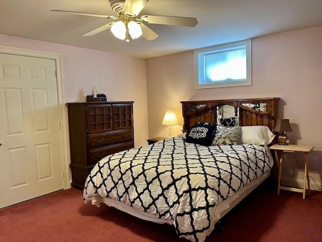 carpeted bedroom featuring ceiling fan