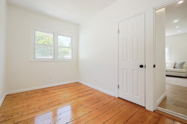 28 Custer St, Rockland, MA 02370 - unfurnished bedroom with light wood-type flooring, multiple windows, baseboards, and recessed lighting