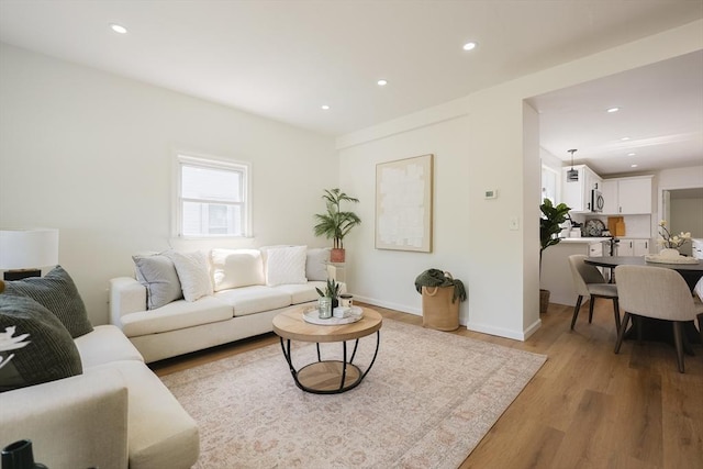 28 Custer St, Rockland, MA 02370 - living area featuring light wood-style floors, recessed lighting, and baseboards