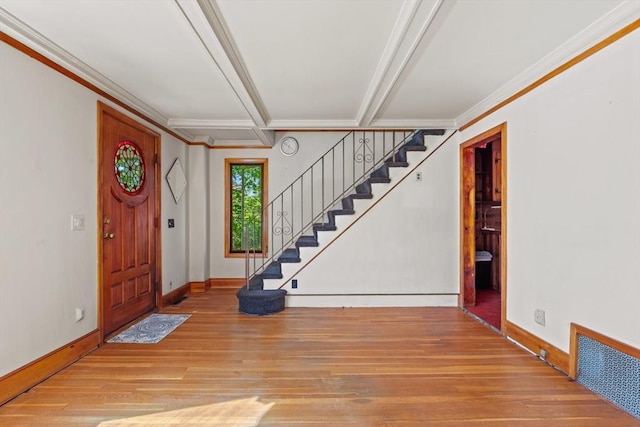 676 Salem St, Groveland, MA 01834 - entryway featuring wood-type flooring, stairs, baseboards, and ornamental molding