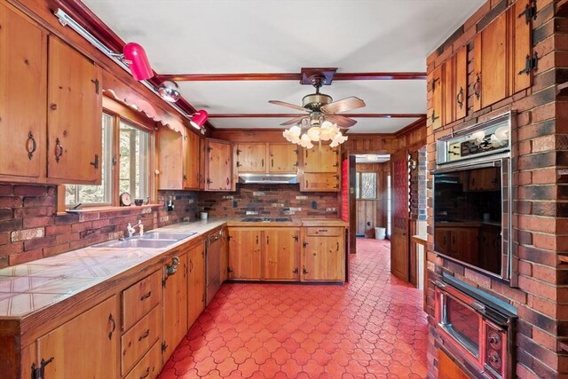 676 Salem St, Groveland, MA 01834 - kitchen with wall oven, a sink, plenty of natural light, and tile countertops